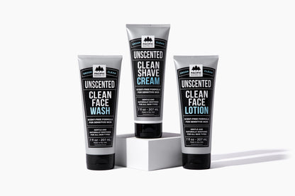 Three tubes of clean, unscented shaving products: face wash, shave cream, face lotion.