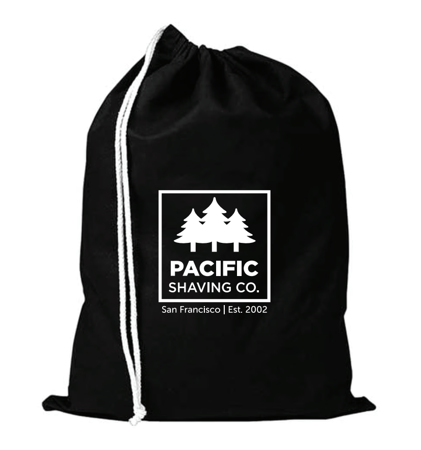 Black drawstring bag with Pacific Shaving Co. logo in white.