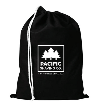 Black drawstring bag with Pacific Shaving Co. logo in white.