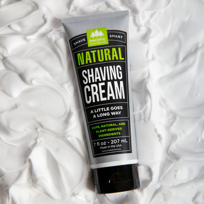 Tube of natural shaving cream on a white shaving cream background
