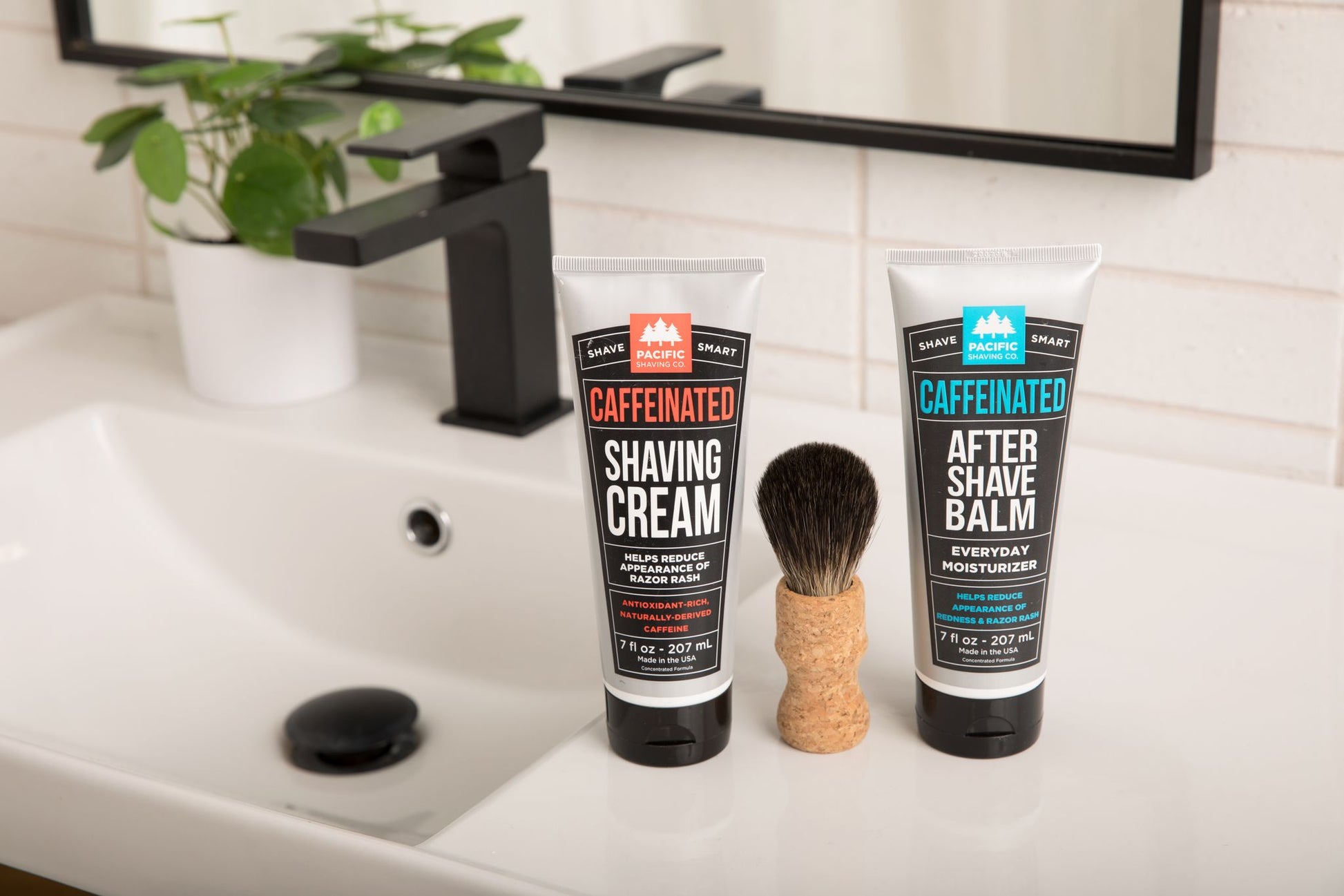Caffeinated Shaving Cream and Aftershave Set with shave brush on sink.
